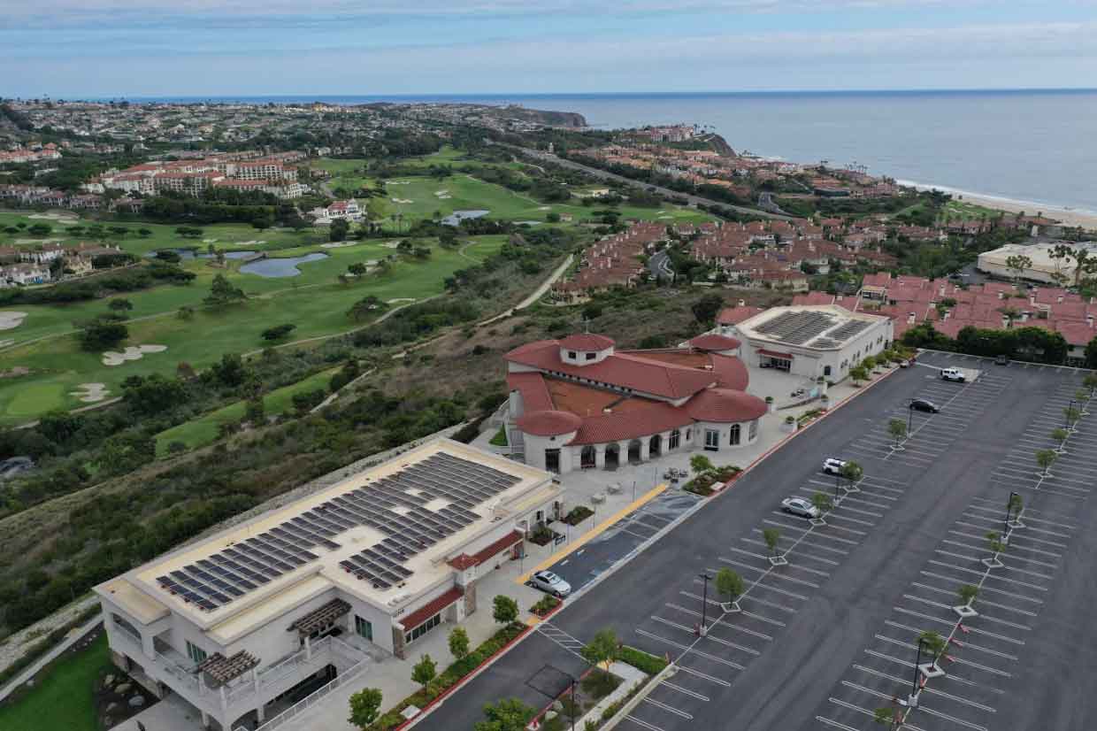 California landscape with a building using solar energy along the coast.