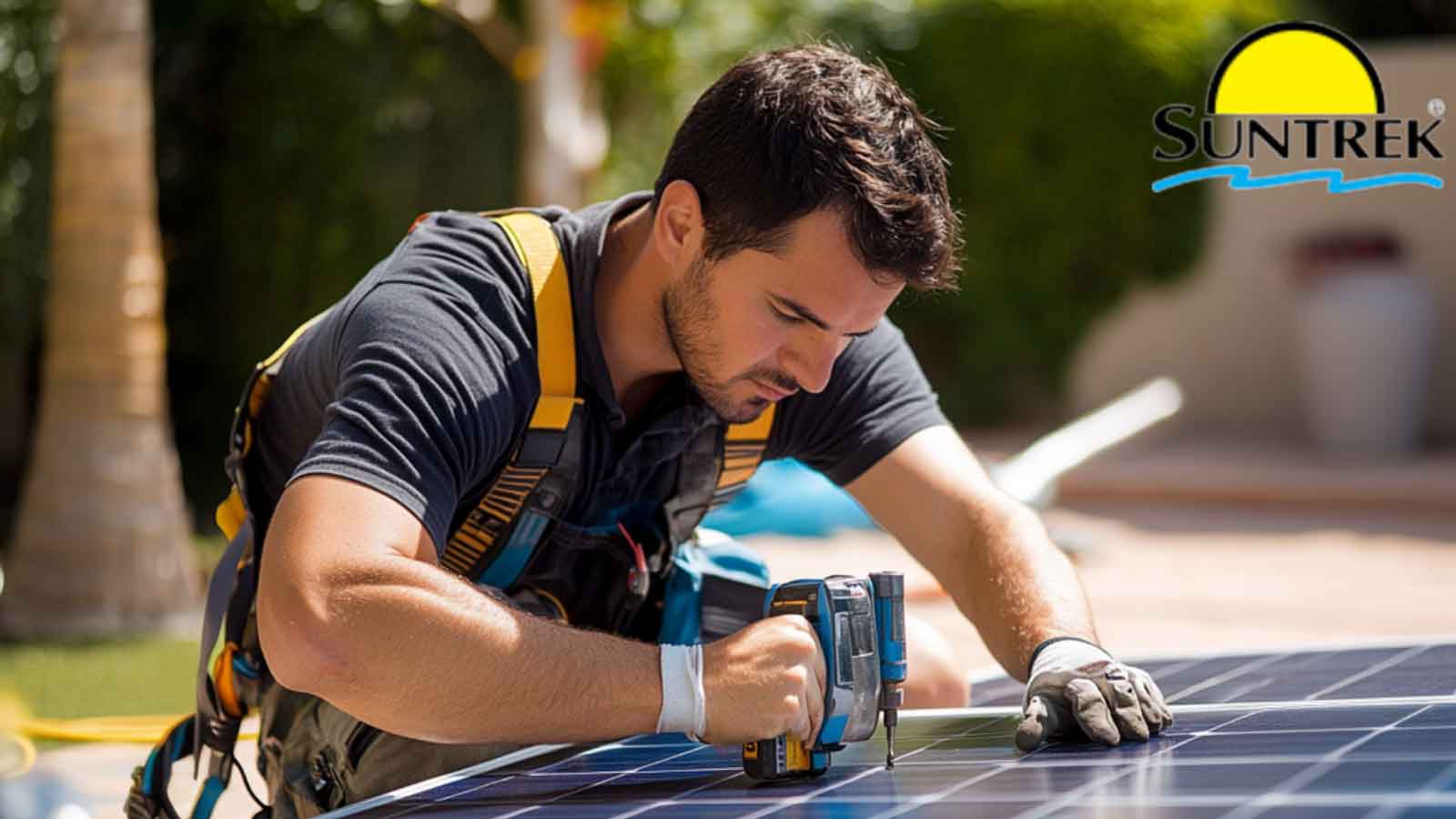 A technician inspects a large solar panel system.