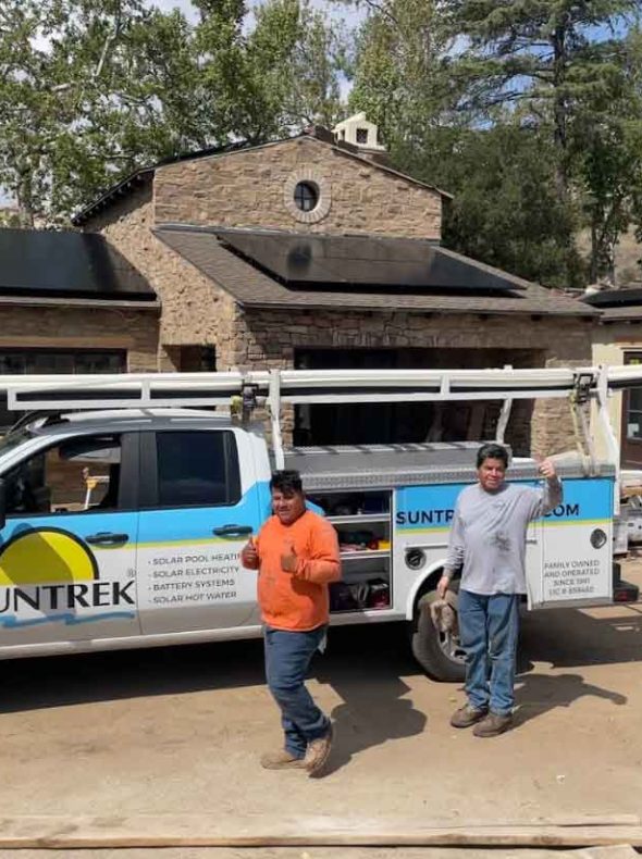 Technicians in front of a Suntrek Solar truck and finishing up a solar panel installation.